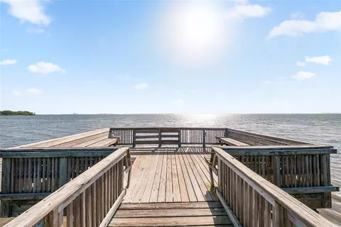 a view of balcony with wooden floor and city view