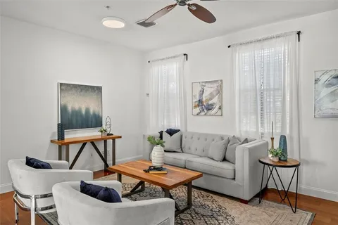 a living room with furniture and a window