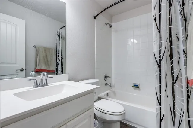 a view of a house with a porch and furniture