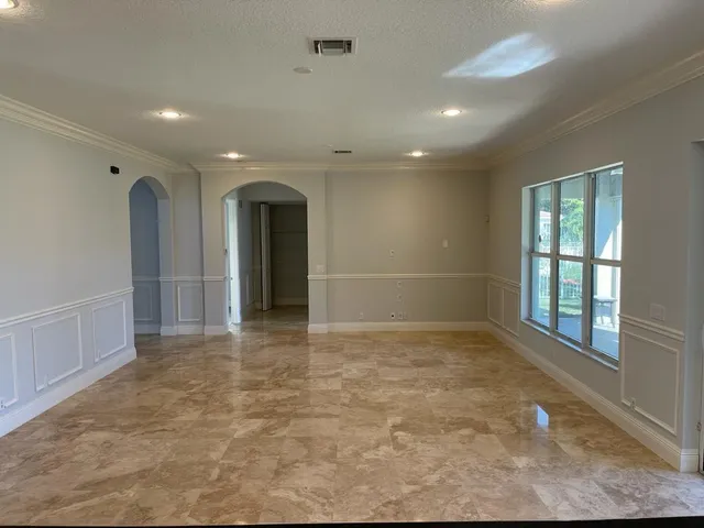 a view of an empty room and window
