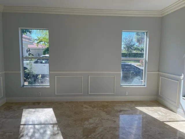 a view of room with a flat tv screen and a toilet