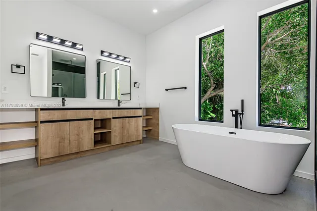 a bathroom with sink and mirror