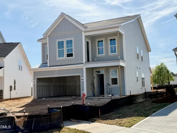 a view of house with yard