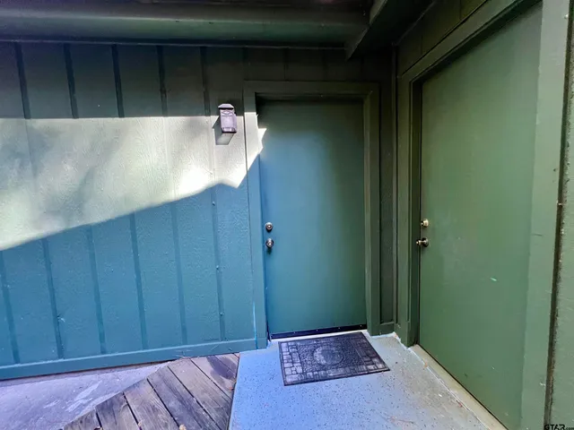 an empty room with a empty space and windows