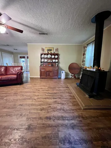 a large kitchen with stainless steel appliances granite countertop a stove and a refrigerator