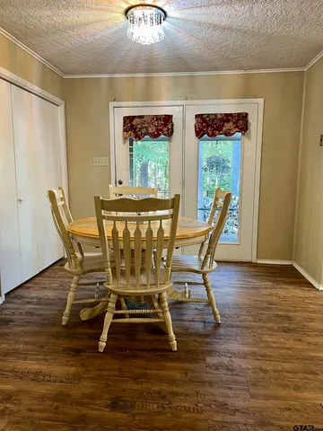 a view of hallway with wooden floor