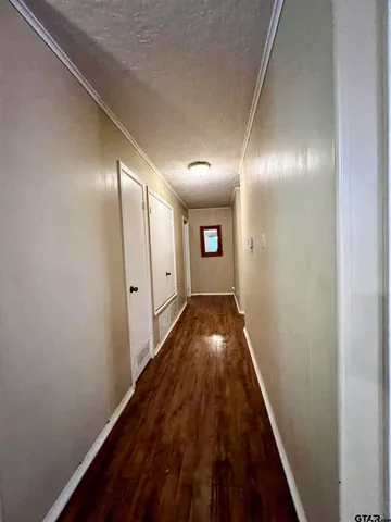 a living room with furniture window and wooden floor
