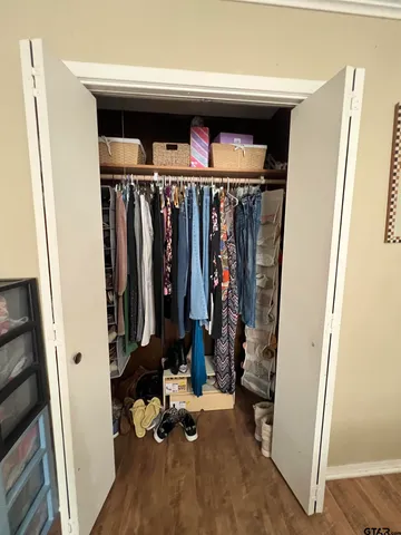 a spacious bathroom with a double vanity sink mirror and toilet