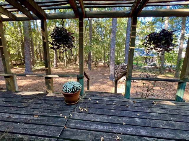 a sitting area with view of the back yard