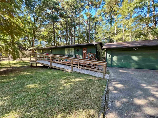 a backyard of a house with lots of green space