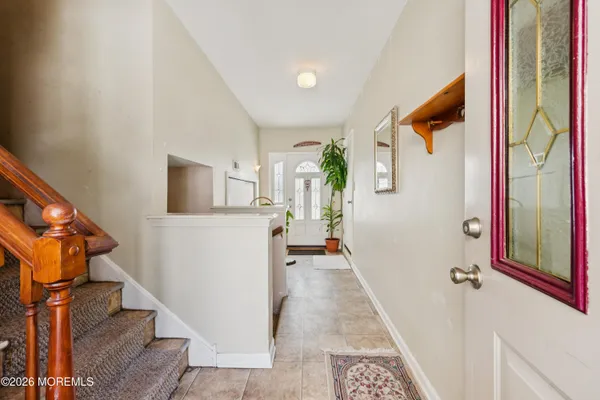 a view of a hallway with furniture and entryway