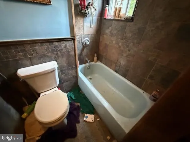 a bathroom with a toilet and a sink