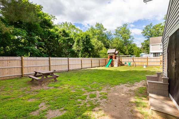 3 Spring Street Salisbury, MA 01952 - Photo 23 of 25 a view of a backyard with lawn chairs