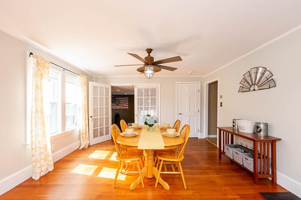 3 Spring Street Salisbury, MA 01952 - Photo 7 of 25 a dining room with furniture window and wooden floor