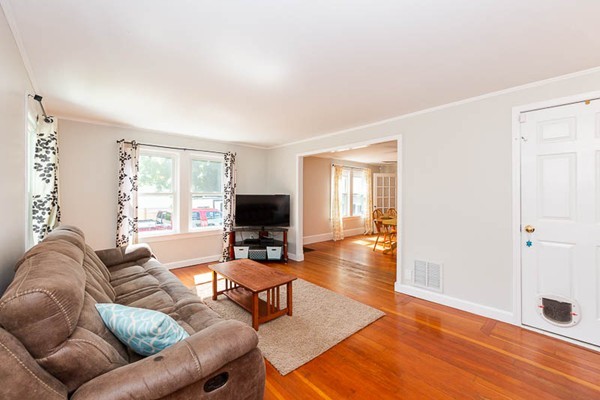 3 Spring Street Salisbury, MA 01952 - Photo 8 of 25 a living room with furniture and a flat screen tv