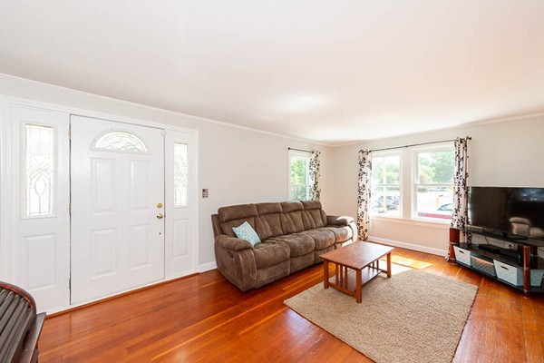 3 Spring Street Salisbury, MA 01952 - Photo 9 of 25 a living room with furniture and a flat screen tv