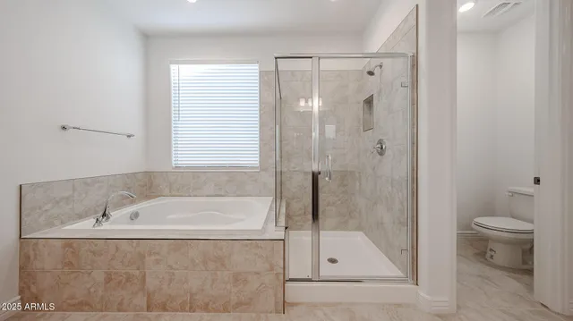 a bathroom with a shower and a bathtub