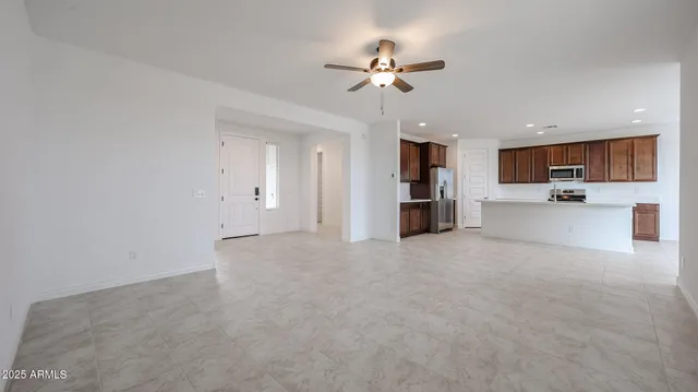 a view of a kitchen with a sink and cabinets