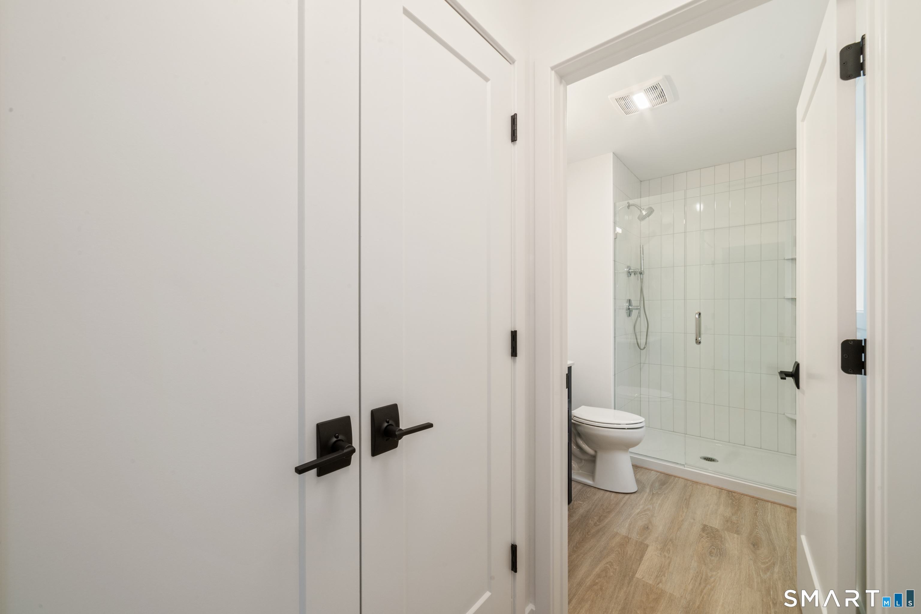 234 Great Plain Road Danbury, CT 06811 - Photo 30 of 40 a bathroom with a granite countertop sink a toilet and shower