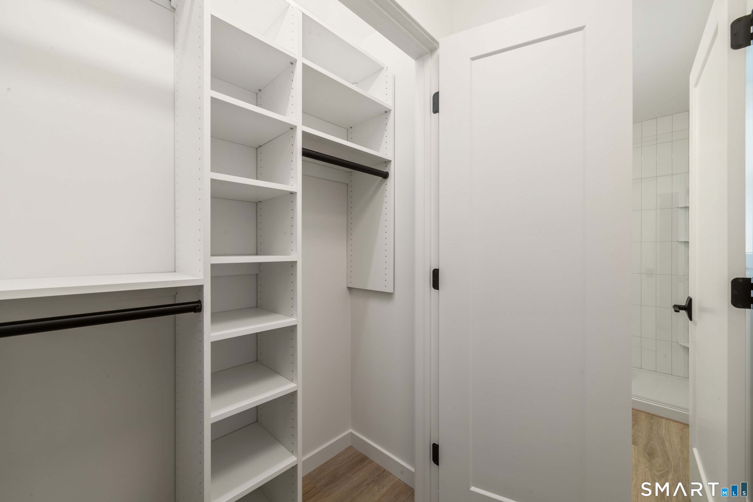 234 Great Plain Road Danbury, CT 06811 - Photo 31 of 40 a view of walk in closet with empty racks