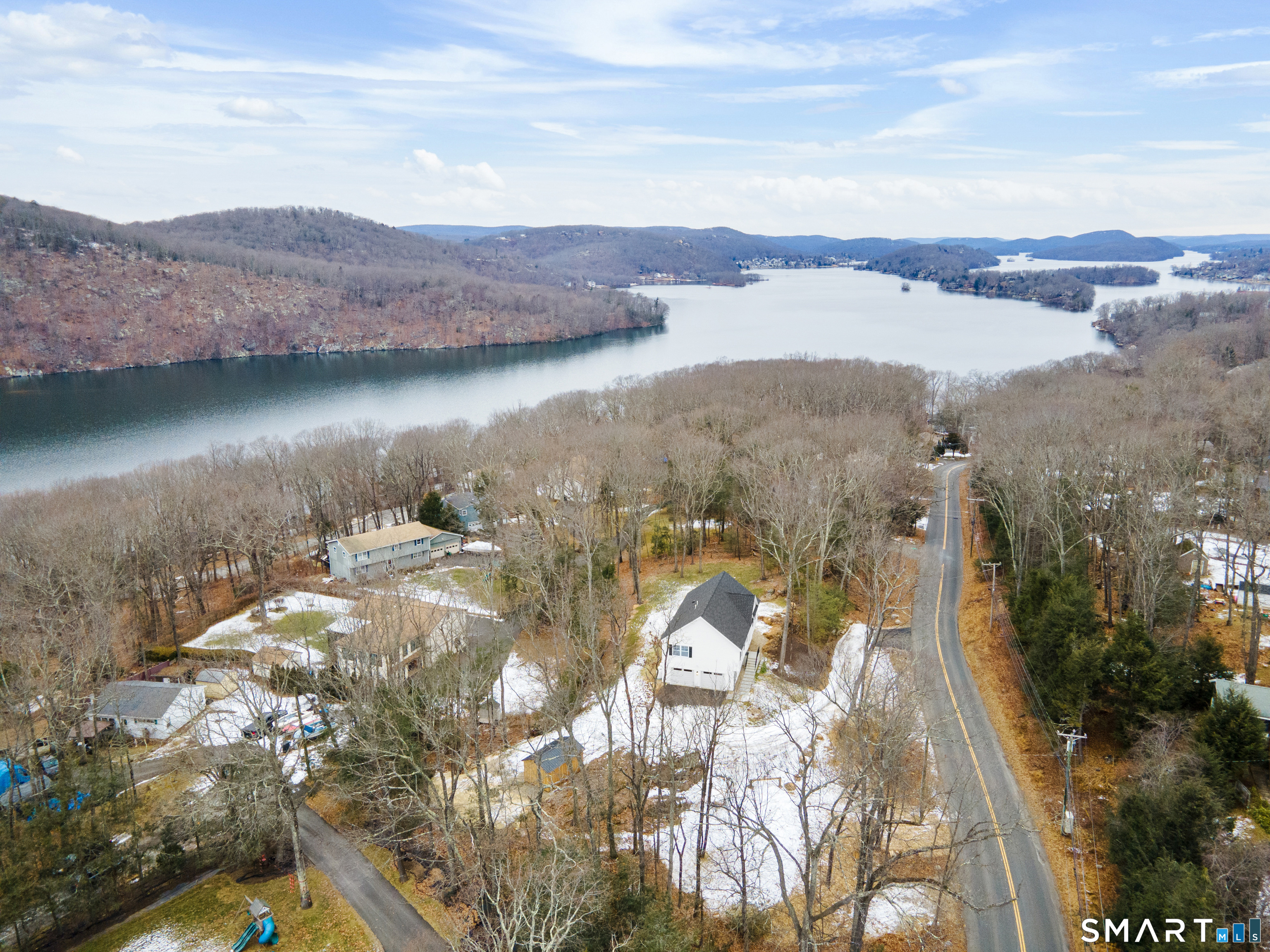 234 Great Plain Road Danbury, CT 06811 - Photo 38 of 40 a view of a lake with a mountain