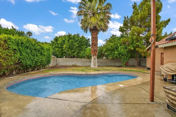 a view of swimming pool with seating space