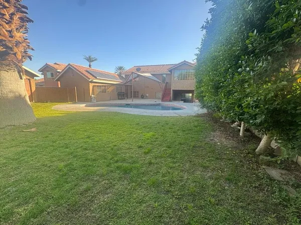 a view of a house with a yard