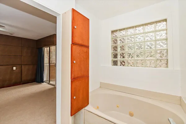 a bathroom with a bathtub and a shower
