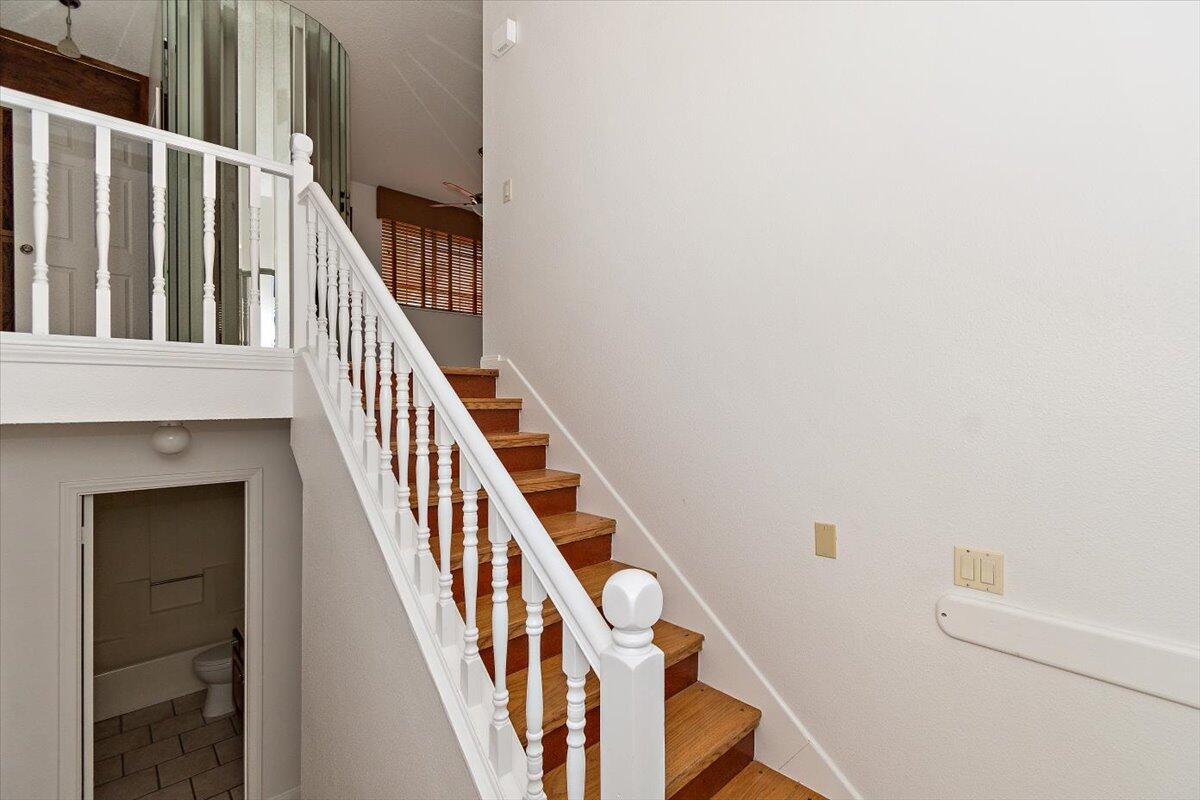 68954 Durango Road Cathedral City, CA 92234 - Photo 7 of 31 a view of staircase with railing and white walls