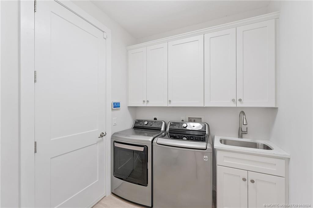 565 Southwest Yacht Basin Way Stuart, FL 34997 - Photo 17 of 55 a room with storage and utility