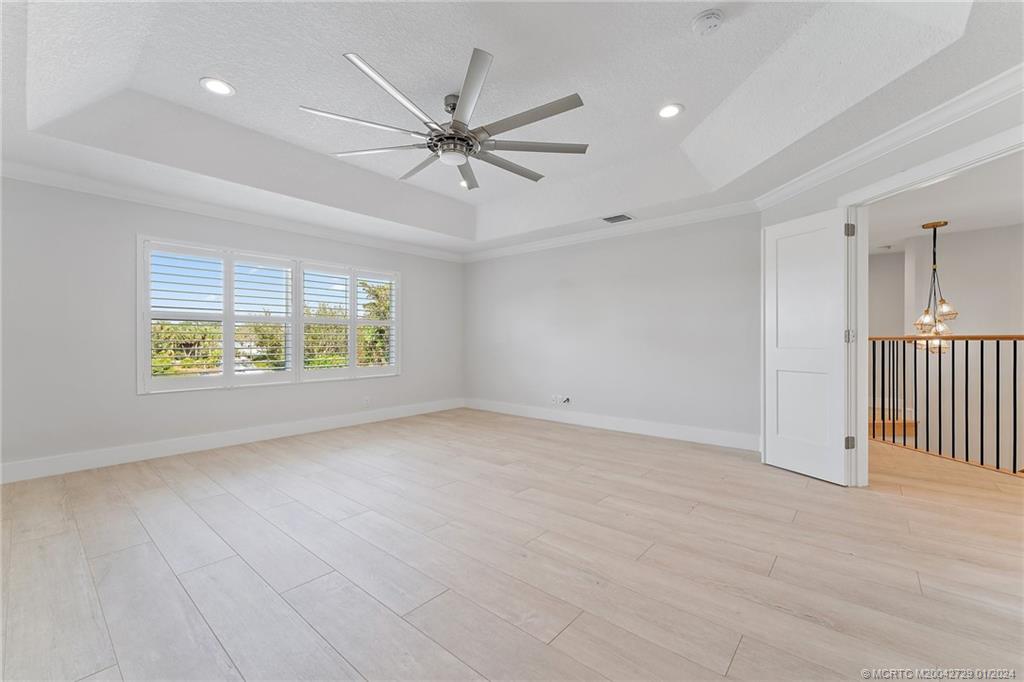 565 Southwest Yacht Basin Way Stuart, FL 34997 - Photo 25 of 55 an empty room with fan and windows