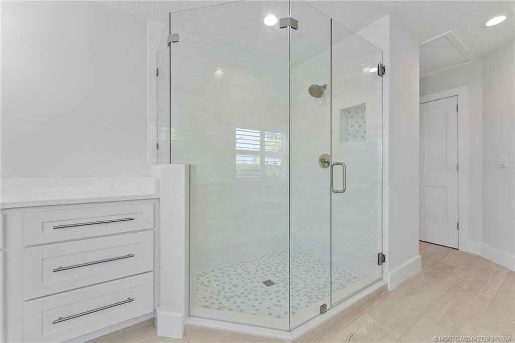 565 Southwest Yacht Basin Way Stuart, FL 34997 - Photo 30 of 55 a bathroom with a shower