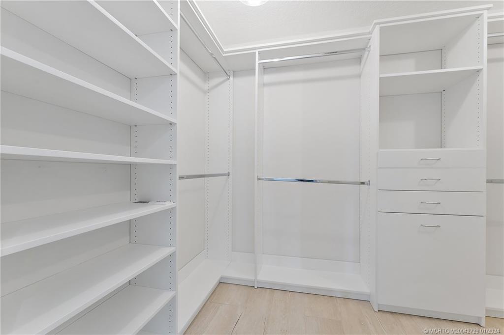 565 Southwest Yacht Basin Way Stuart, FL 34997 - Photo 32 of 55 a view of walk in closet with empty racks