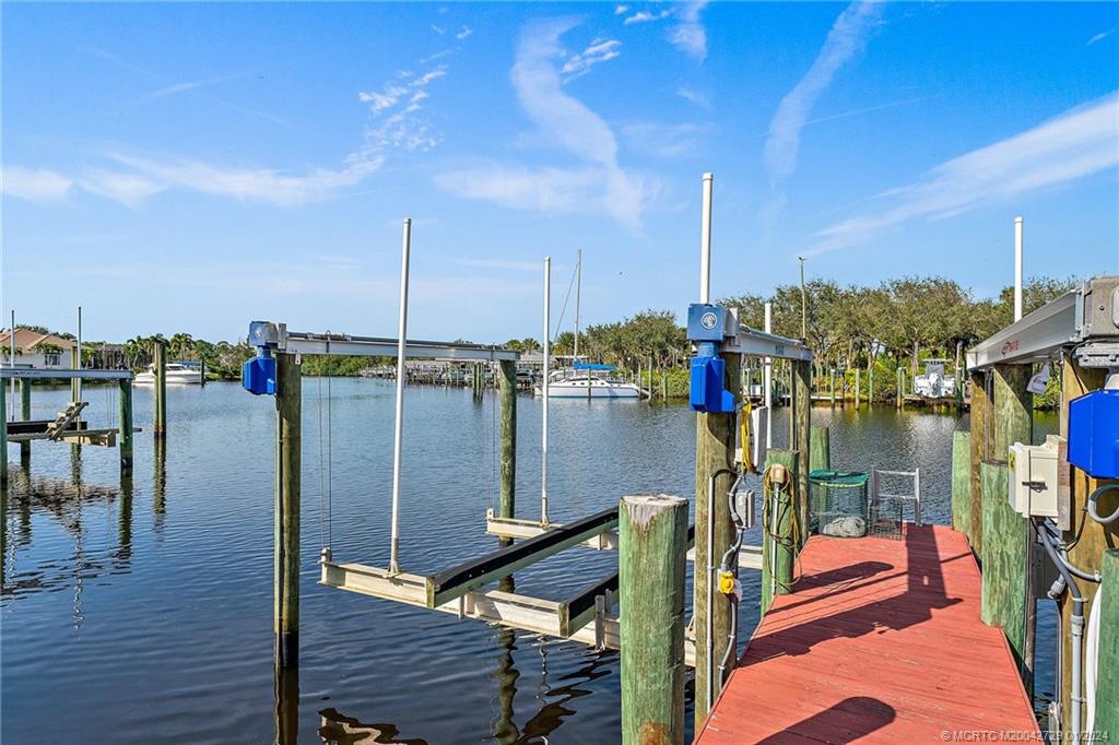 565 Southwest Yacht Basin Way Stuart, FL 34997 - Photo 45 of 55 a city view from a balcony with chairs