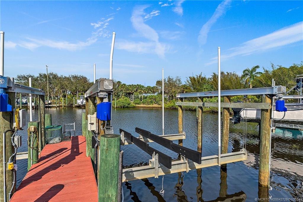 565 Southwest Yacht Basin Way Stuart, FL 34997 - Photo 46 of 55 a roof deck with table and chairs