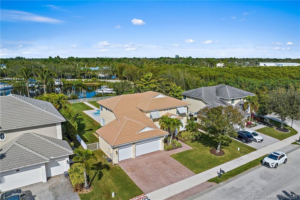 565 Southwest Yacht Basin Way Stuart, FL 34997 - Photo 47 of 55 an aerial view of a house with a garden