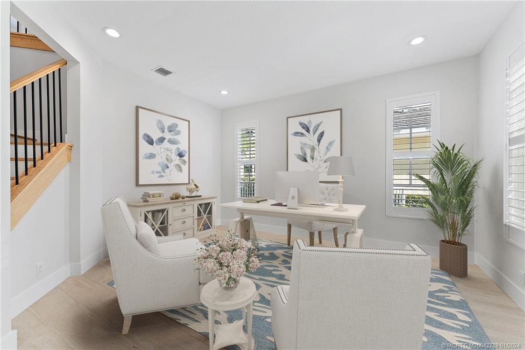 565 Southwest Yacht Basin Way Stuart, FL 34997 - Photo 5 of 55 a living room with furniture and a painting on the wall