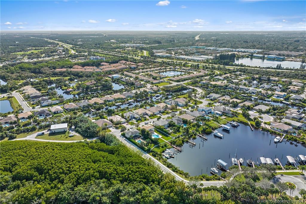 565 Southwest Yacht Basin Way Stuart, FL 34997 - Photo 53 of 55 an aerial view of residential building with outdoor space and lake view