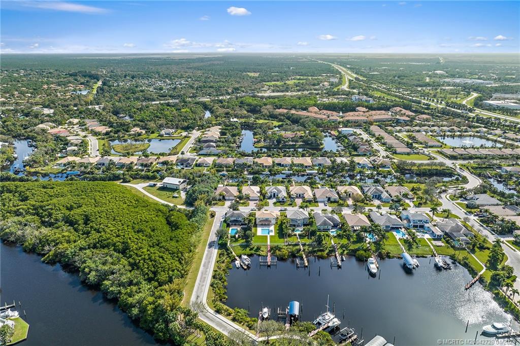 565 Southwest Yacht Basin Way Stuart, FL 34997 - Photo 54 of 55 an aerial view of residential houses with outdoor space and trees
