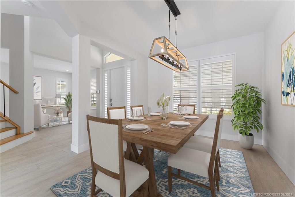 565 Southwest Yacht Basin Way Stuart, FL 34997 - Photo 6 of 55 a view of a dining room with furniture and window