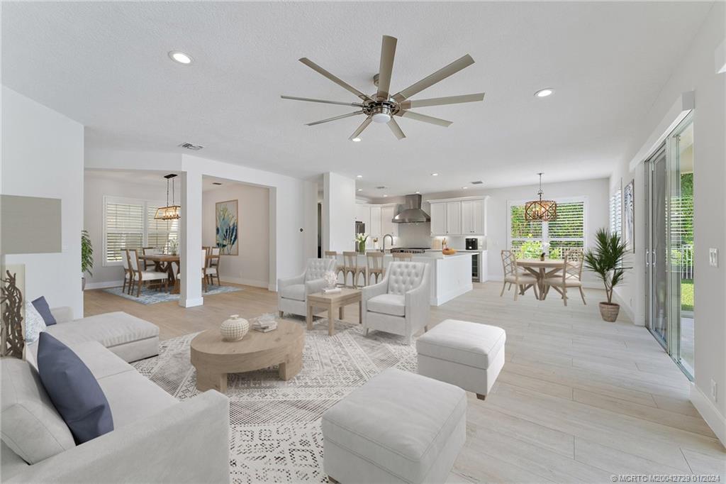 565 Southwest Yacht Basin Way Stuart, FL 34997 - Photo 8 of 55 a living room with furniture and a large window