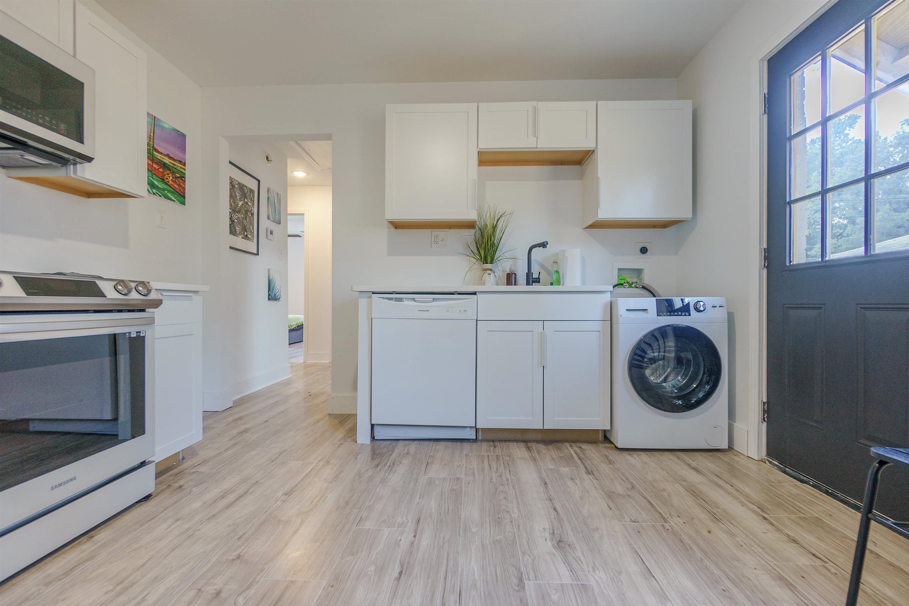 84 North Holmes Street Memphis, TN 38111 - Photo 14 of 18 Laundry area with washer / dryer and light wood-style flooring