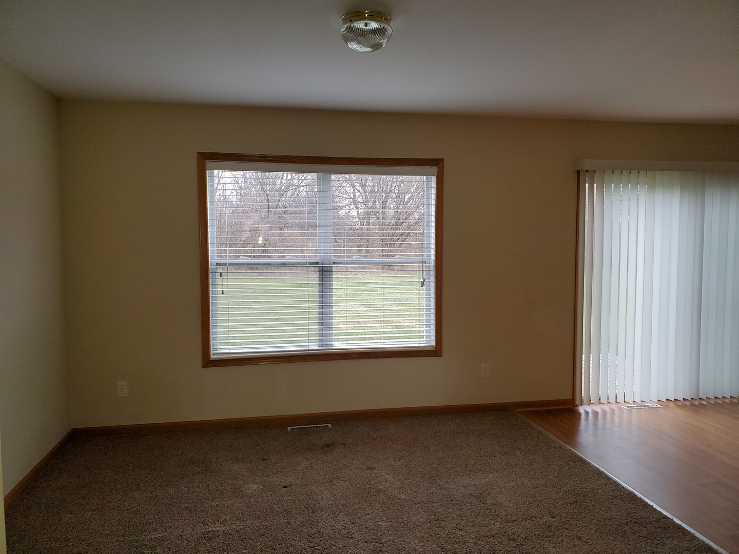 131 Lamplighter Loop Southeast Poplar Grove, IL 61065 - Photo 2 of 13 an empty room with a window