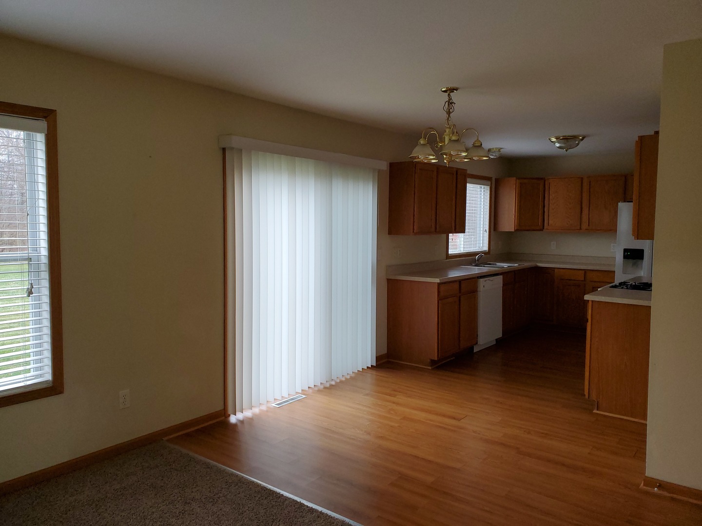 131 Lamplighter Loop Southeast Poplar Grove, IL 61065 - Photo 4 of 13 a kitchen with stainless steel appliances granite countertop a refrigerator a sink dishwasher a stove and a microwave oven on granite countertops