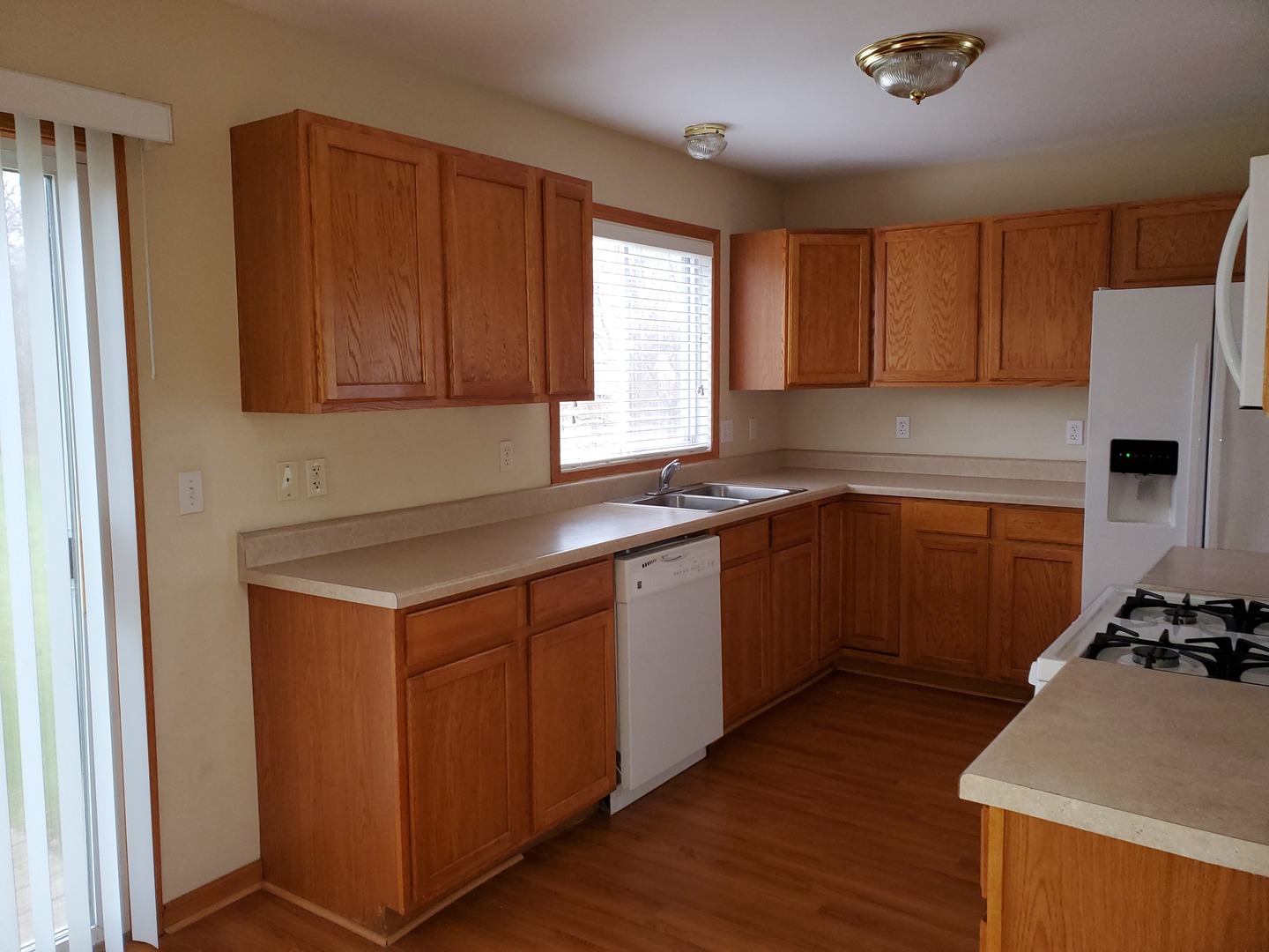 131 Lamplighter Loop Southeast Poplar Grove, IL 61065 - Photo 6 of 13 a kitchen with a sink cabinets and window