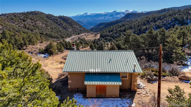 a kitchen with stainless steel appliances granite countertop a stove top oven a sink dishwasher and a microwave oven on the blue kitchen countertops