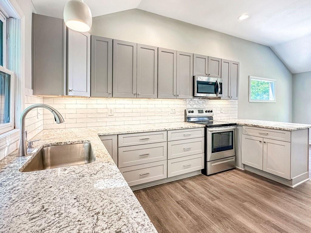 2350 Old Spring Road Smyrna, GA 30080 - Photo 11 of 26 a kitchen with white cabinets sink and stainless steel appliances