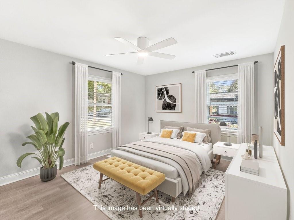 2350 Old Spring Road Smyrna, GA 30080 - Photo 13 of 26 a bedroom with a large bed and a potted plant