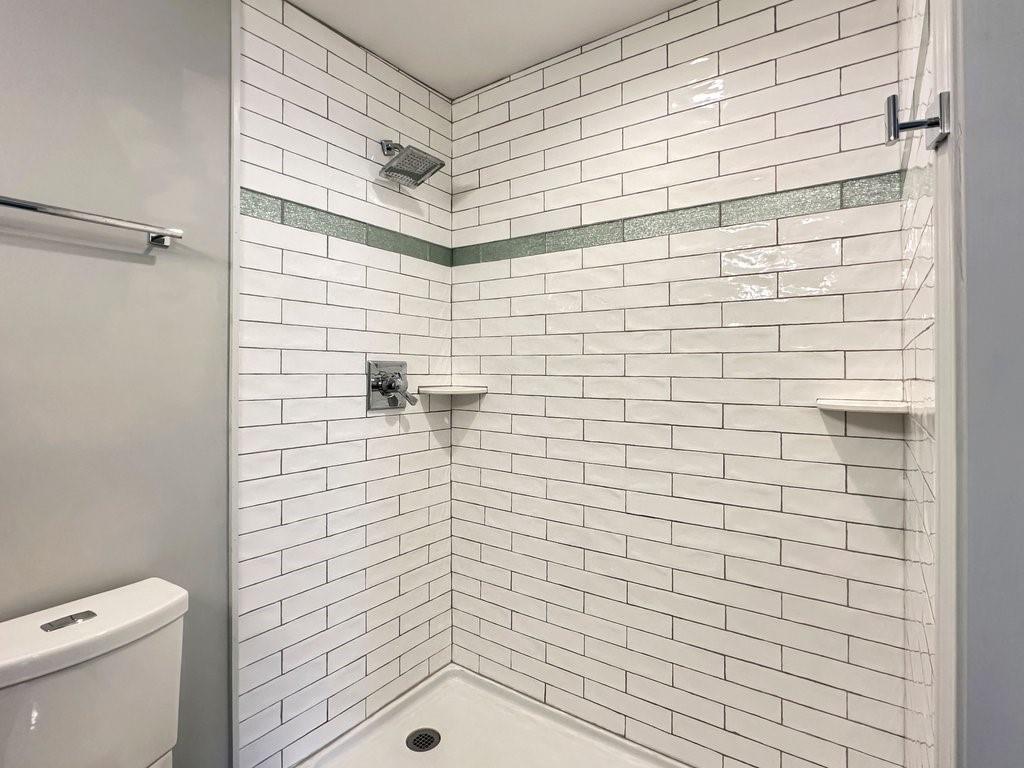 2350 Old Spring Road Smyrna, GA 30080 - Photo 16 of 26 a bathroom with a shower and a toilet