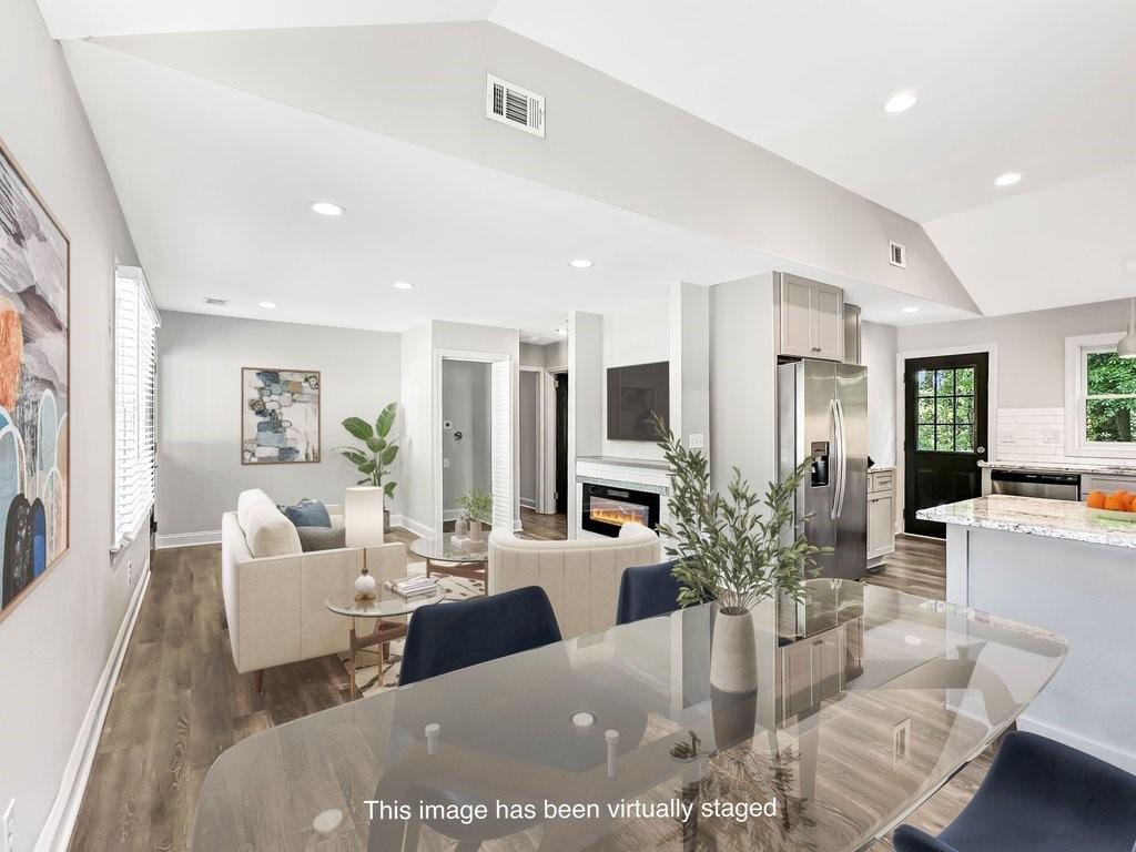 2350 Old Spring Road Smyrna, GA 30080 - Photo 9 of 26 a living room with fireplace furniture and a view of kitchen